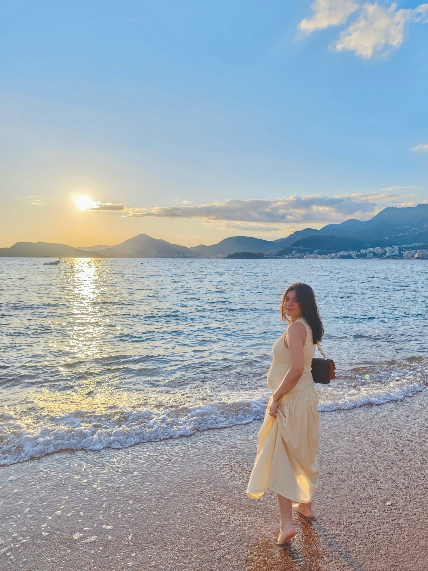 Maryam beside the sea at sunset